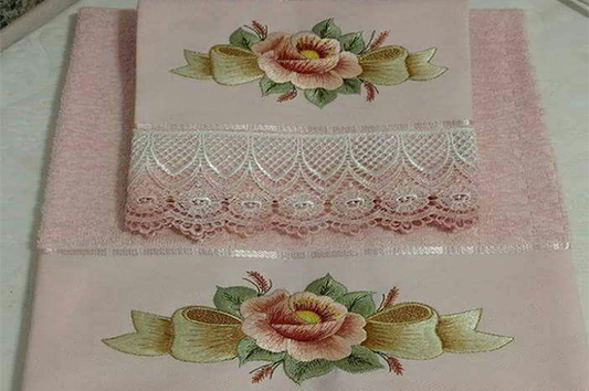 Elegant rose embroidery design on pink fabric