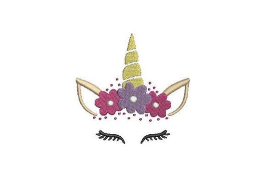 Magical unicorn face embroidery design with flowers and closed eyes.